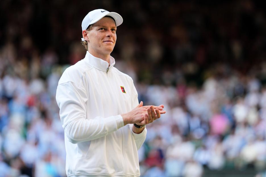 Jannik Sinner of Italy applauding after a Wimbledon semi-final match.