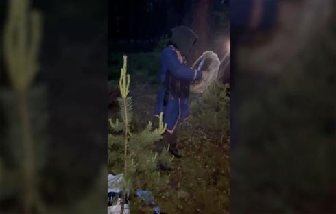 Police raid a Russian forest ceremony.