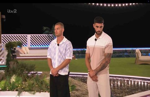 Two men standing during a Love Island recoupling.