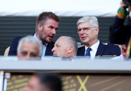 David Beckham and Arsène Wenger seated together.