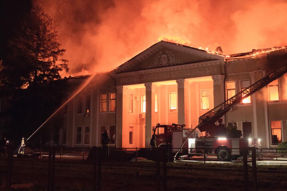 Firefighters battling a fire at a building in Kharkiv, Ukraine.