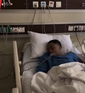 Person sleeping in a hospital bed.