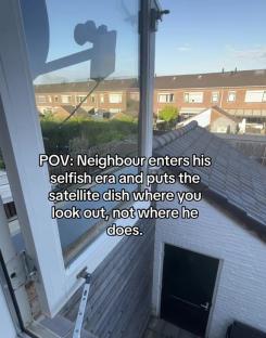 Satellite dish obstructing window view.