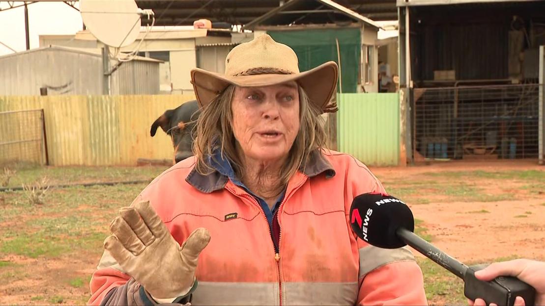 Woman in a hat being interviewed.