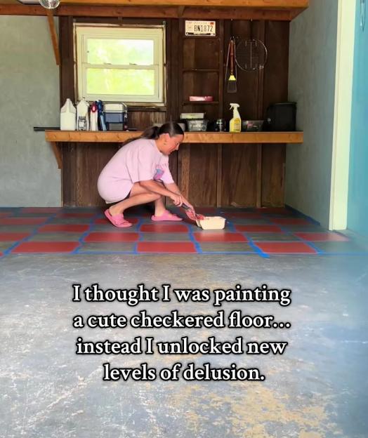 Woman painting a checkered floor in a shed.
