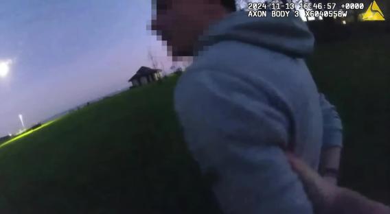 Police officer apprehending a suspect.