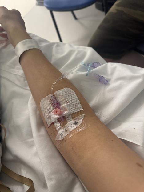 Close-up of an IV line in a patient's arm.