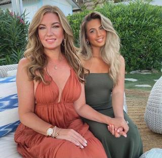 Karren Brady and her daughter Sophia Peschisolido sitting together.