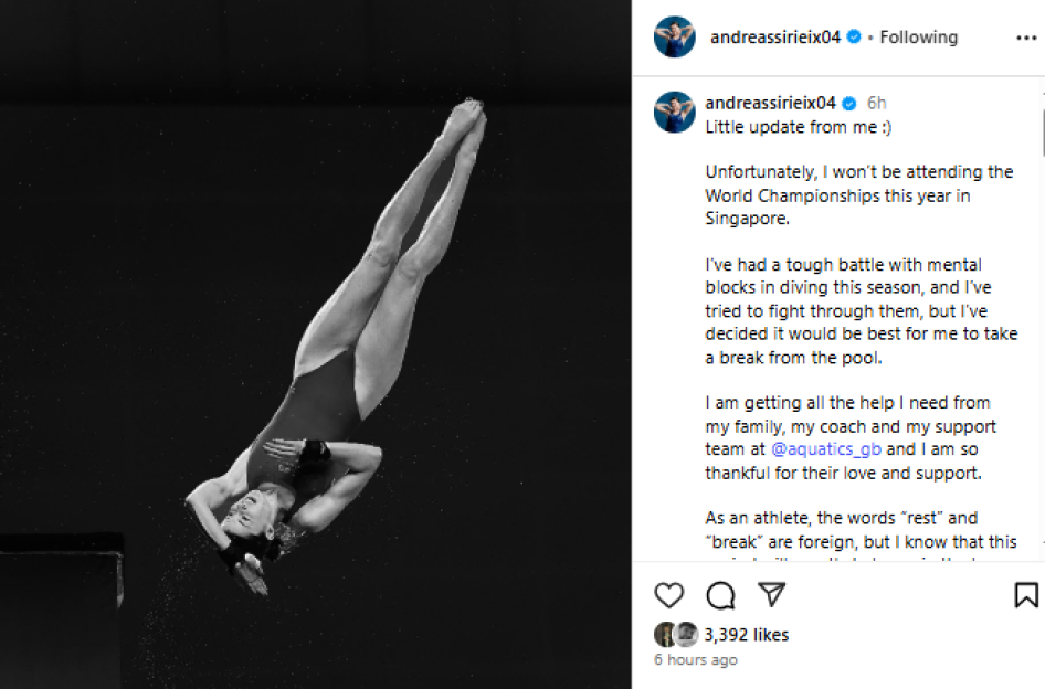 Black and white photo of a diver in mid-air.