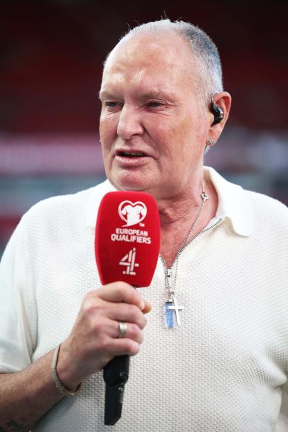 Paul Gascoigne holding a Channel 4 European Qualifiers microphone.