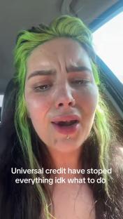 Close-up of a person with lime green hair crying and saying