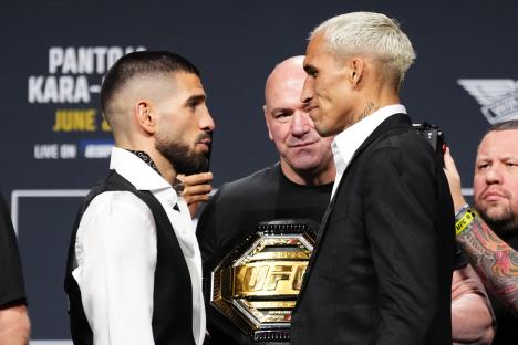 Ilia Topuria and Charles Oliveira face off at a UFC press conference.
