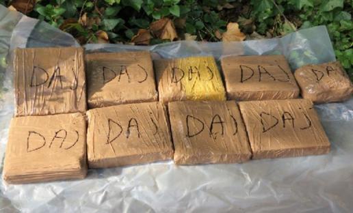 Seized blocks of heroin and cocaine.