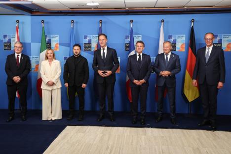 Group photo of world leaders at a NATO summit.