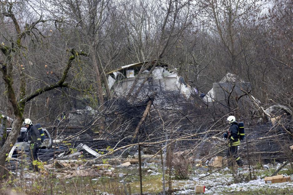 Emergency personnel at the site of a plane crash.