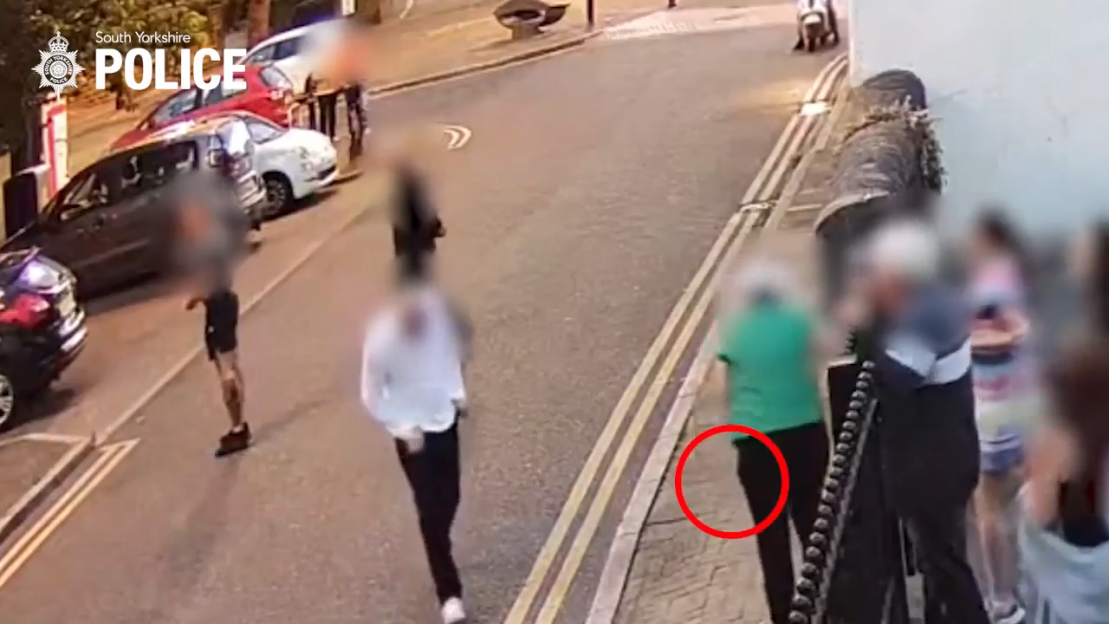Security camera footage of a pub brawl where a gunman opens fire.