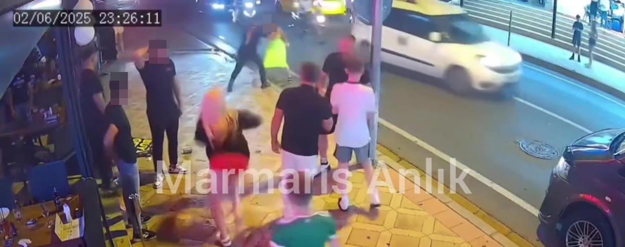Security camera footage of a fight outside a bar.