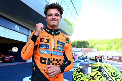 Lando Norris celebrates after qualifying for pole position.