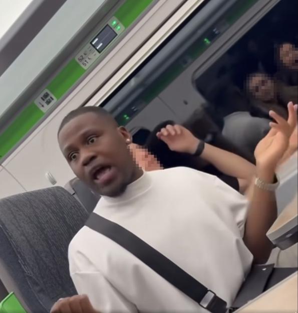 Man yelling threats on a train.