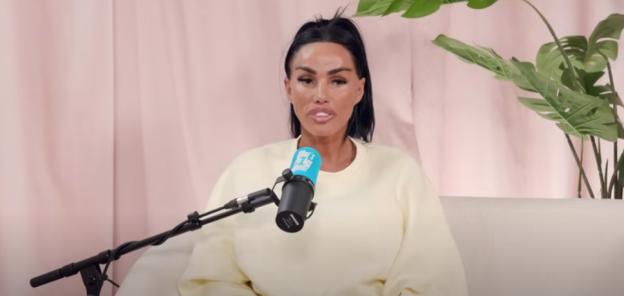 Screenshot of a woman speaking into a microphone during a podcast interview.