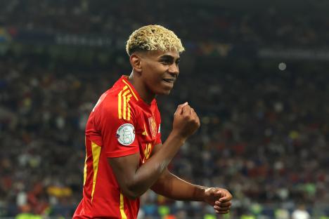 Lamine Yamal of Spain celebrating during a soccer match.