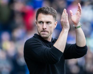 Aaron Ramsey, manager of Cardiff City, applauding fans.