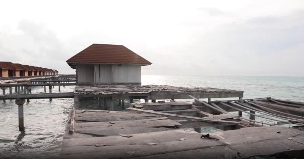 Abandoned overwater bungalows in the Maldives.