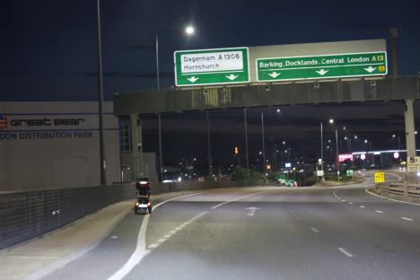 Mobility scooter on A13 highway at night.
