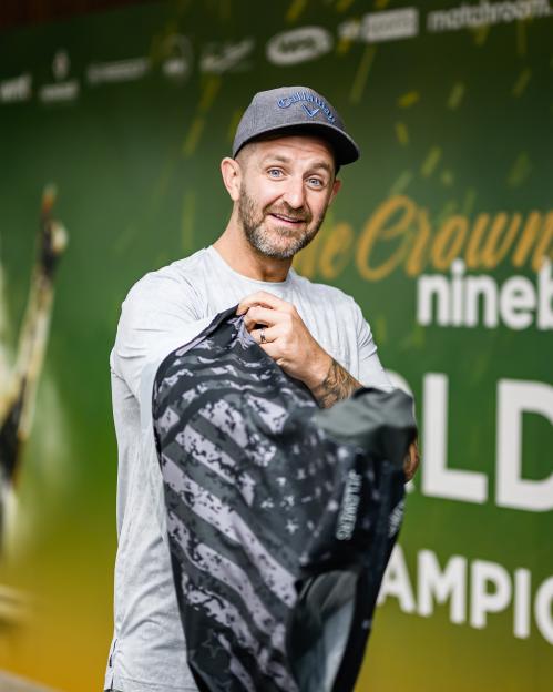 A man holding a bag at the World Pool Championships.