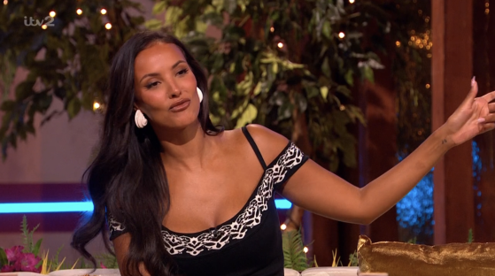 Screenshot of a woman gesturing.