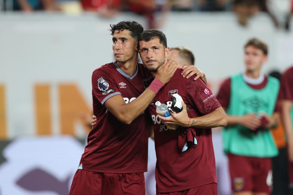 Nayef Aguerd and Guido Rodriguez of West Ham United embrace.