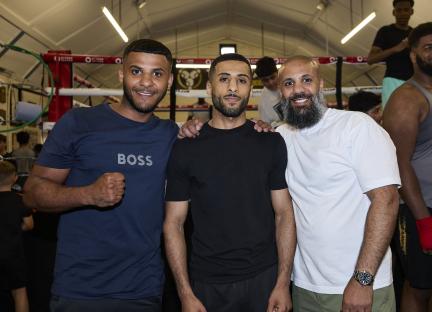 Three boxers, Galal Yafai and two brothers, at a boxing gym.