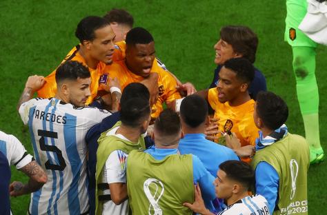 Netherlands and Argentina soccer players clashing during a game.