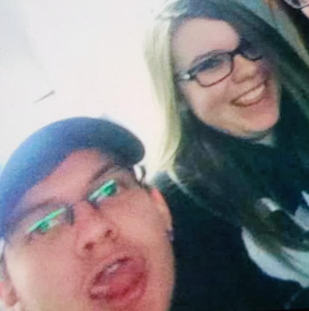 Selfie of three people, one man and two women.