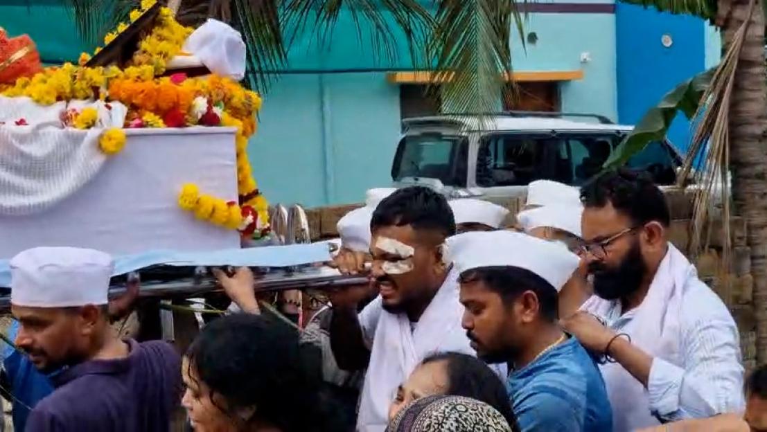Sole survivor of an Air India plane crash carrying his brother's coffin at his funeral.