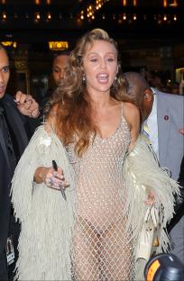 Miley Cyrus in a sheer beaded dress outside the Beacon Theatre.