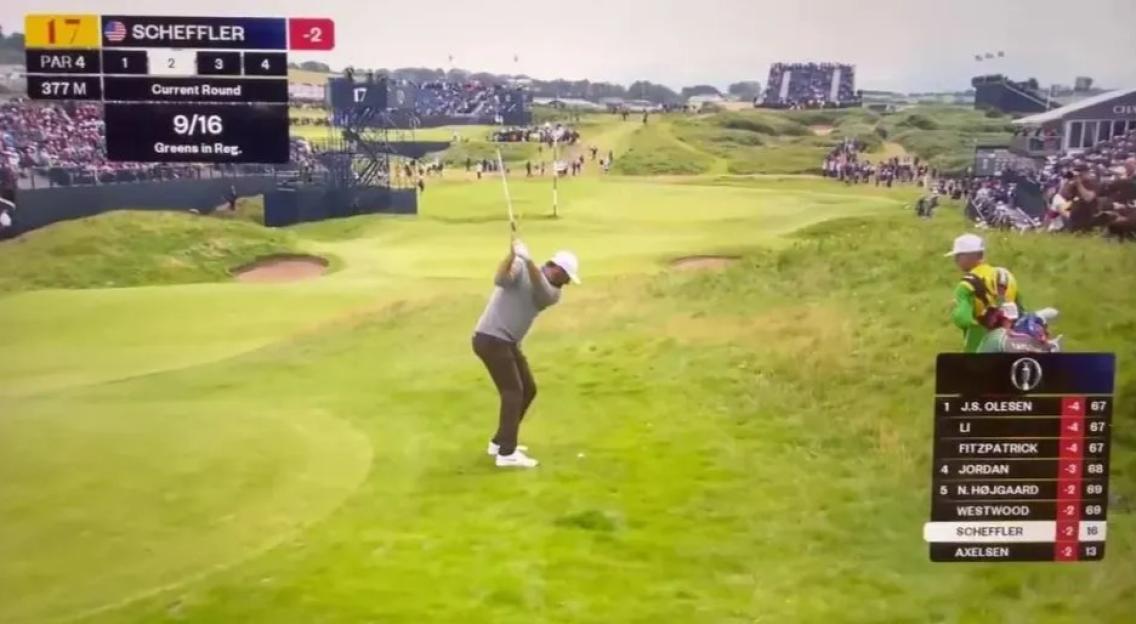 Golfer taking a shot on a golf course.