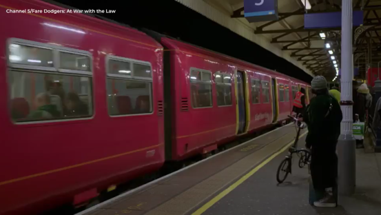 Screenshot of a red train at a station.