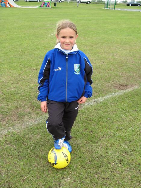 Young Georgia Stanway with soccer ball.