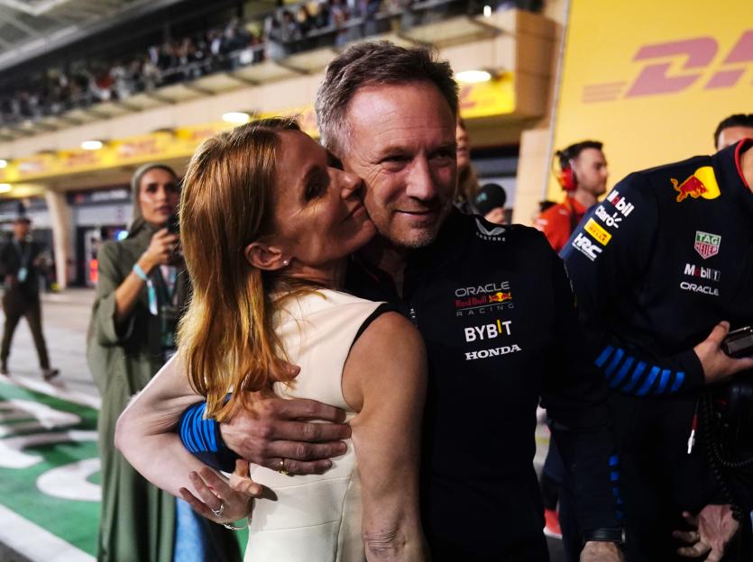 Christian and Geri Horner embracing after a Red Bull Racing win.
