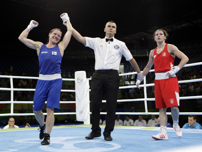 Mira Potkonen of Finland wins a women's lightweight boxing match at the Olympics.