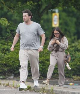 Jack Fincham and Chloe Brockett walking together.