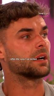 Screenshot of a man from Love Island crying.