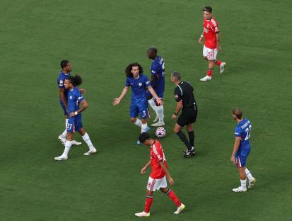 Marc Cucurella of Chelsea reacting to a weather delay during a soccer match.