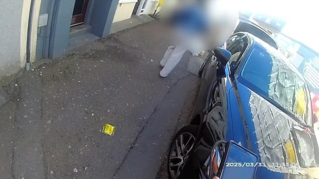 CCTV footage of a driver receiving a £250 fine for littering a parking ticket.