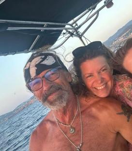 A man and woman on a boat in Ibiza.