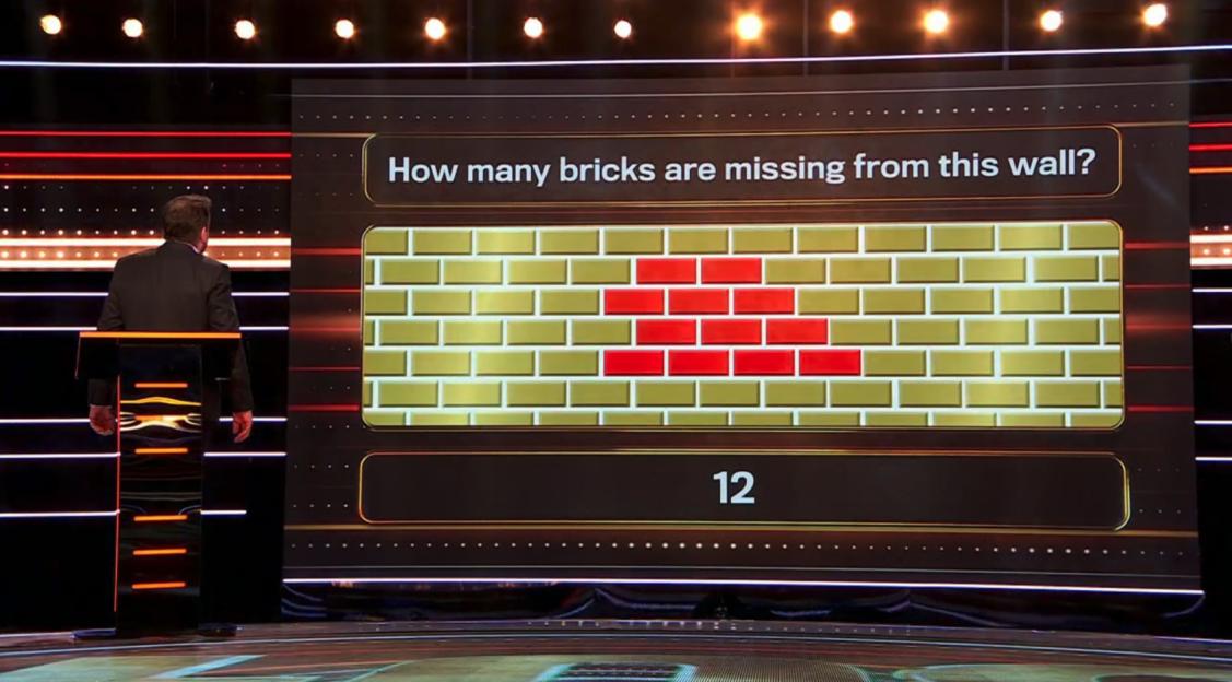 Screenshot of a game show question: How many bricks are missing from this wall? The answer, 12, is displayed.