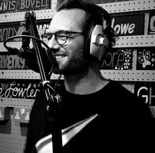 Black and white photo of Eden Blackman recording audio.