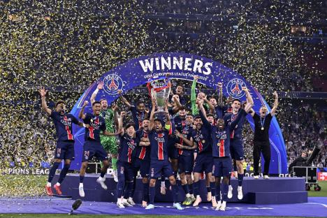 MUNICH, GERMANY - MAY 31: Marquinhos of Paris Saint-Germain lifts the trophy after winning the UEFA Champions League Final 2025 against FC Internazionale Milano at Allianz Arena on May 31, 2025 in Munich, Germany. (Photo by Aurelien Meunier - PSG/PSG via Getty Images)