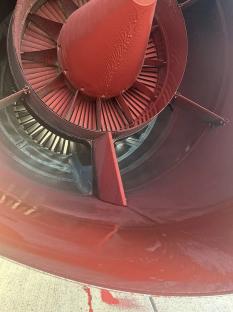 Red paint on the engine of a military aircraft.